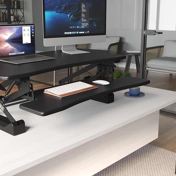Mount-It! Standing Desk Converter, 48" Wide Sit Stand Desk Riser with Dual Gas Spring Handles, Height Adjustable from 6"–19.25", Extra Large Tabletop for 2 Monitors, Keyboard Tray & Device Slot, Black